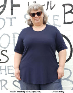 Plus size woman in navy blue tee, non clingy fabric, ethically made in Australia