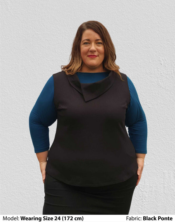 Front view of size 24 model dressed for work in a womens plus size vest with collar in black Low pill ponte.