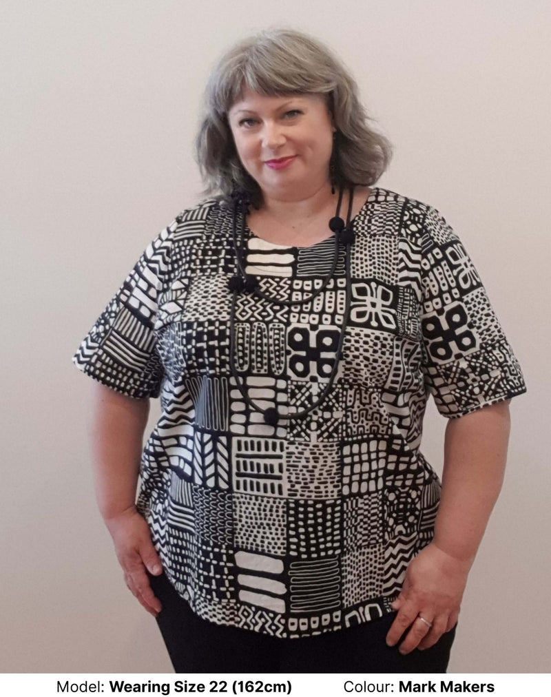 chasing springtime plus size model wearing cotton blouse in miss moresby print